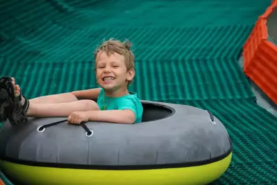 boy on tubing hill